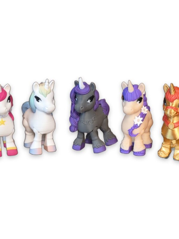 articulating-unicorn-figurine-2-inch-1 Five small unicorn figurines in different colors lined up side by side, each with articulating legs.
