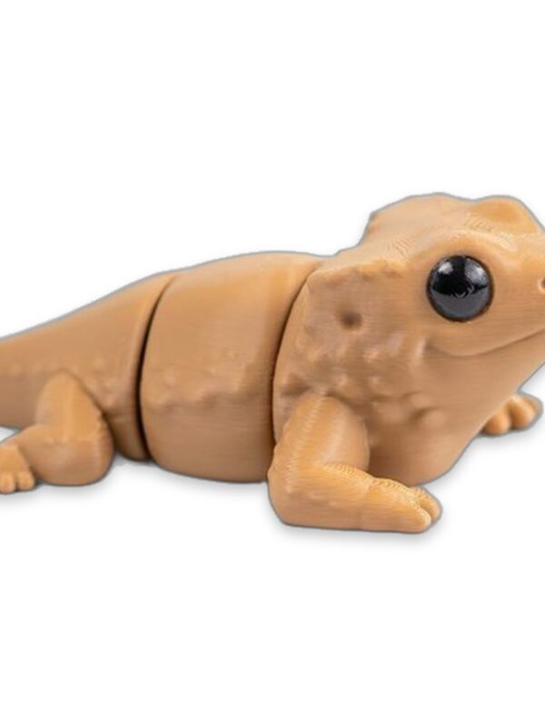 articulated-baby-bearded-dragon-fidget-toy-1 Tan articulated bearded dragon figure lying with legs bent, shown from the side.