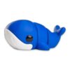 Blue whale figurine shown at a low angle highlighting its glossy eye and white underside.