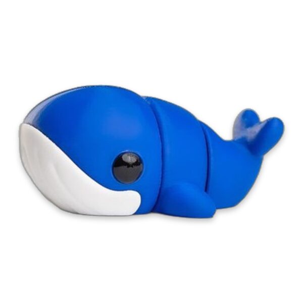 Blue whale figurine shown at a low angle highlighting its glossy eye and white underside.