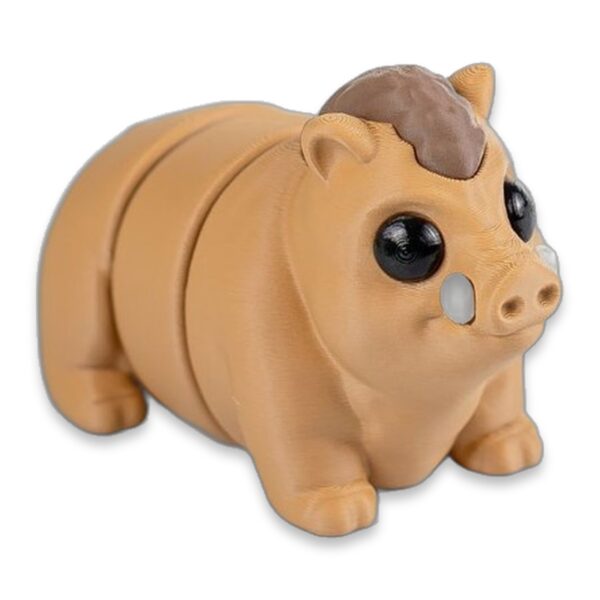 Close-up side view of the baby boar figure showing its large dark eyes and brown hair tuft