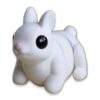 White articulated bunny figure sitting with ears up and head turned, showing its segmented poseable body.