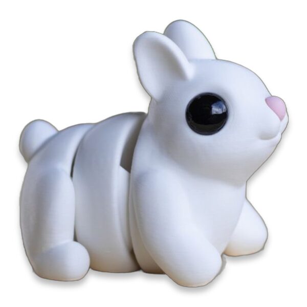 White articulated bunny figure in profile, showing the jointed segments along its back and legs.