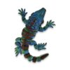 articulated-iguana-3d-printed-3 Teal and green articulated iguana figure viewed from above with front legs raised and tail curled.