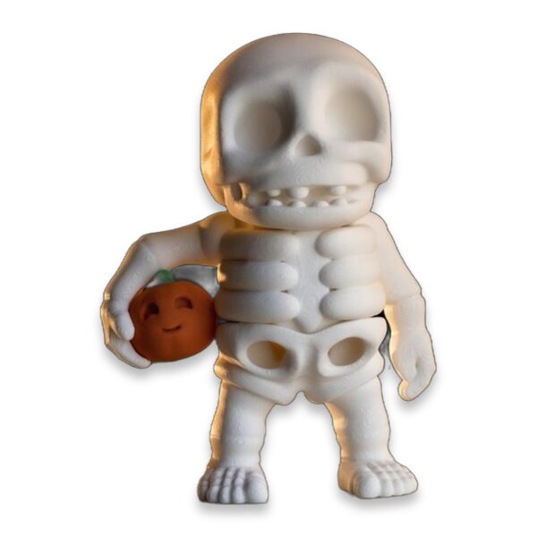 articulated-skeleton-fidget-toy-pumpkin-1 A small white 3D printed skeleton figure standing and holding an orange pumpkin in one hand.