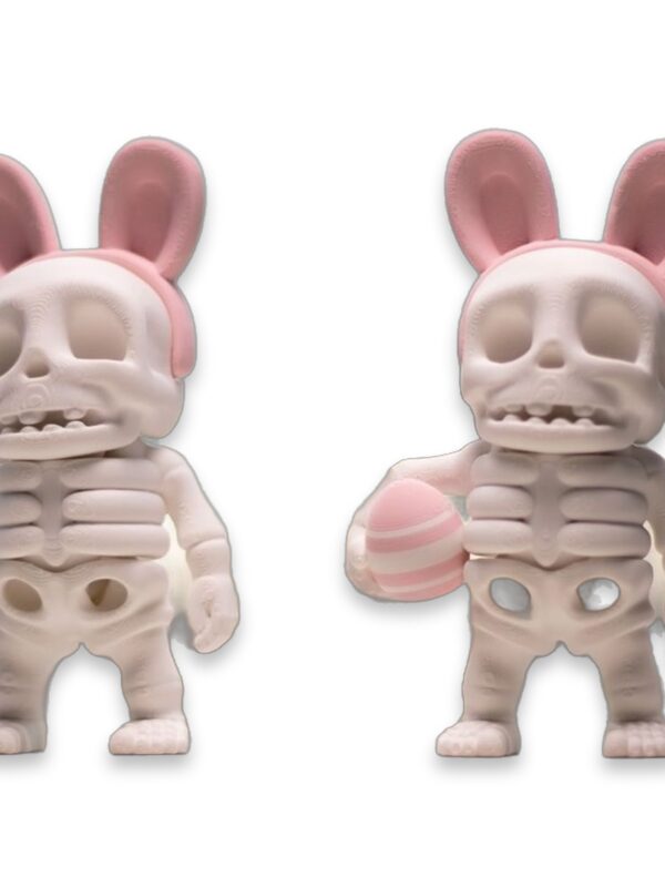 Two articulated 3D printed Easter skeletons wearing pink bunny ears, one holding a striped Easter egg