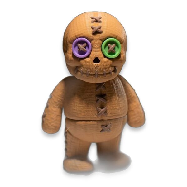 articulated-voodoo-doll-fidget-toy-poseable-desk-buddy-2 Close-up front view showing the stitched skull head and mismatched button eyes.