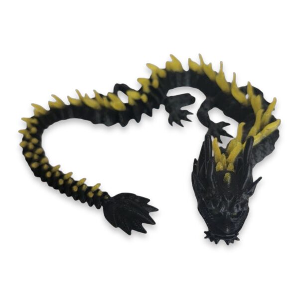 Black and yellow articulated dragon curled into a loop with its head and spiked tail visible.