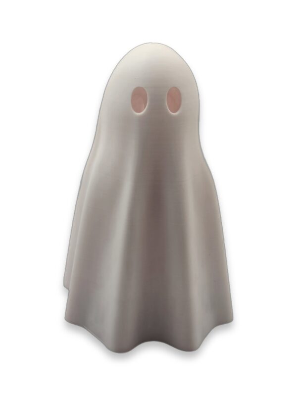 A small gray ghost figurine with two oval cutout eyes, standing upright facing forward.