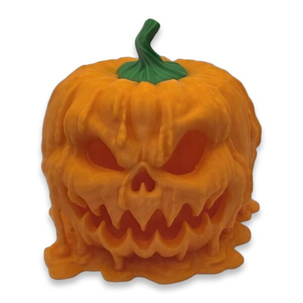 melting-pumpkin-candy-dispenser-1 Front view of an orange melting jack-o'-lantern figurine with a snarling carved face and green stem
