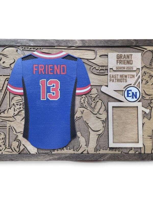 personalized-jersey-sign-layered-wood-stadium-scene-1 Layered wood sign with a blue and red baseball jersey reading FRIEND 13, surrounded by an etched stadium scene, team name, and a small photo frame.