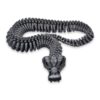 skeleton-snake-fidget-toy-articulated-4 A tan skeleton snake coiled in loops with its fanged skull facing forward.