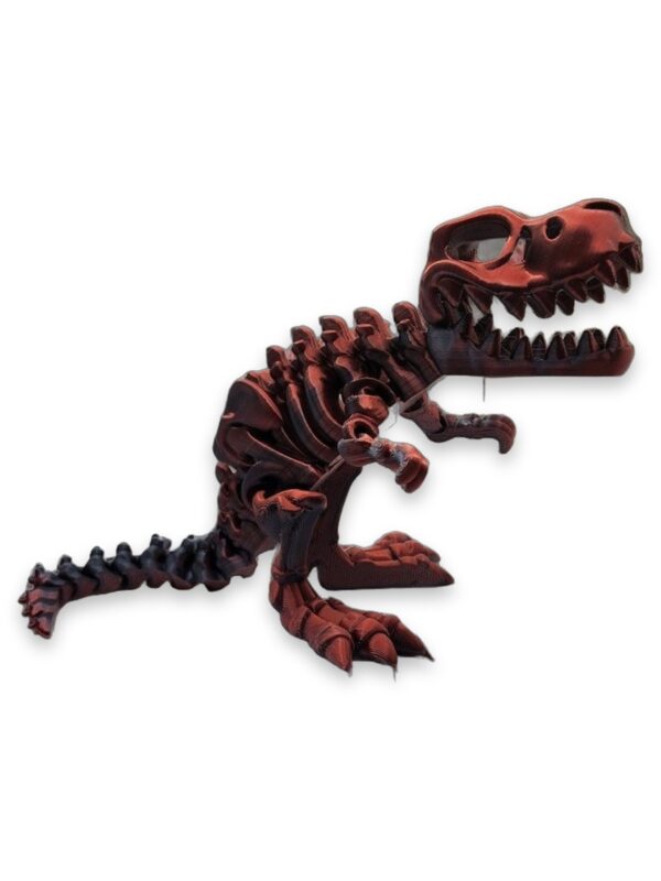 t-rex-fidget-toy-articulated-poseable-1 Copper-toned 3D printed T-Rex skeleton toy posed standing with mouth open.