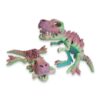 Two pastel rainbow T-Rex skeleton toys lying on their sides, each gripping a bone.